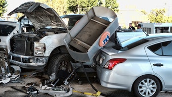 Los Angeles driver barrels truck into gas station, knocking over pump and injuring 11, including kids