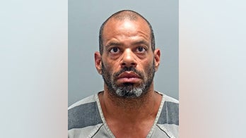 Nevada janitor found living with family and illegal weapons in children's museum: police