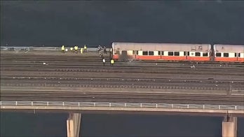 Boston train catches fire, evacuating passenger jumps into river