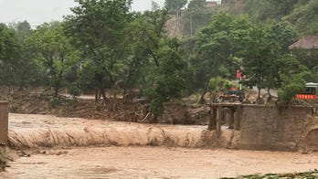 China floods leave at least 12 dead, thousands evacuated
