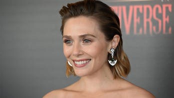 Elizabeth Olsen hits Emmy red carpet in dress designed by sisters Mary-Kate and Ashley Olsen 