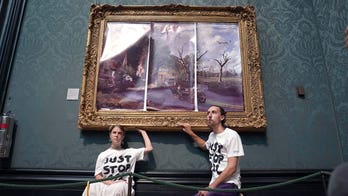 UK climate protesters glue themselves to Constable frame