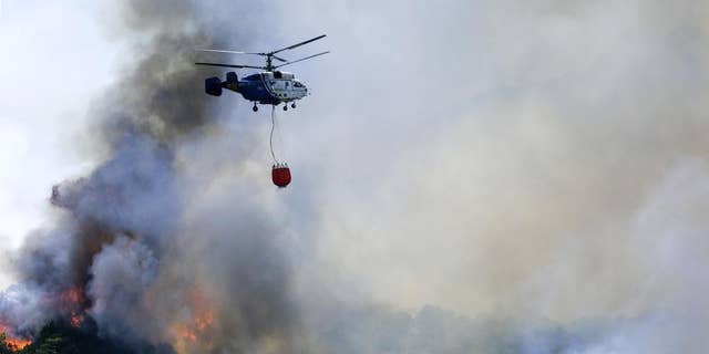 Bosbranden branden terwijl delen van Spanje te maken hebben met een recordhittegolf. 