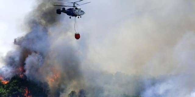 Wildfires rage as parts of Spain battle a record heatwave.