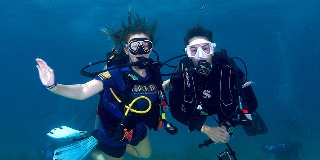Guy Harvey Ocean Foundation co-chair Jessica Harvey and a Force Blue team member dive on a coral reef conservation mission in Islamorada, Florida, in June 2022.