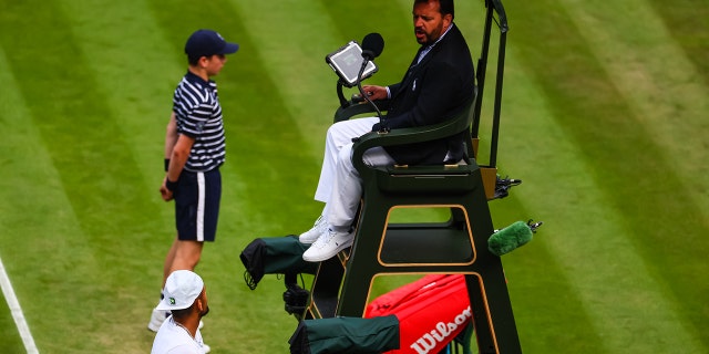 Nick Kyrgios of Australia argues with the umpire after Stefanos Tsitsipas of Greece hit a ball into the crowd during day six of The Championships Wimbledon 2022 at All England Lawn Tennis and Croquet Club on July 02, 2022 in London, England. 