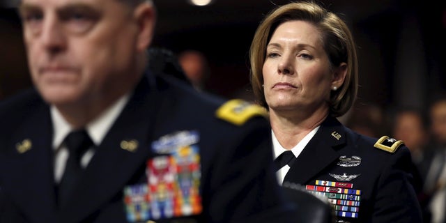 U.S. Army Major General Laura J. Richardson, the first woman to serve as a deputy commander of a combat division, listens while seated behind Army Chief of Staff Gen. Mark Milley (L) during a Senate Armed Services Committee hearing on the implementation of the decision to open all ground combat units to women on Capitol Hill in Washington, February 2, 2016.