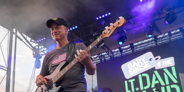 Gary Sinise plays the bass with his band
