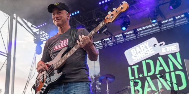 Gary Sinise plays the bass with his band