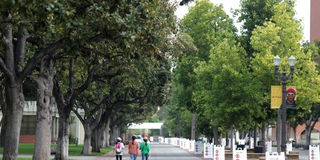 People walk on an empty University of Southern California (USC) campus in Los Angeles, California, U.S., August 17, 2020.