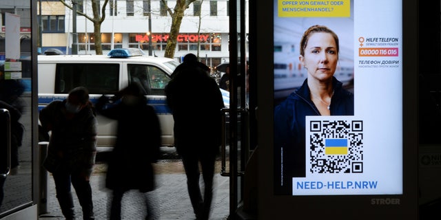 A digital information board at the central station of Duesseldorf, Germany, sends message to female refugees who may be victims of "violence or human trafficking," March 31, 2022.