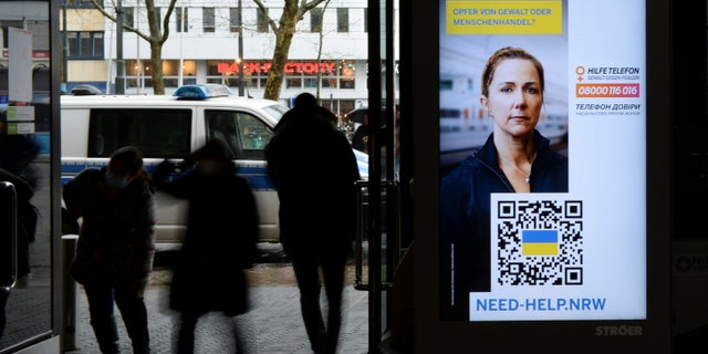 A digital information board warns female refugees from Ukraine, amid Russia's invasion, at the central station of Duesseldorf, Germany March 31, 2022. The board reads "victim of violence or human trafficking?"