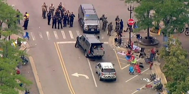 Police deploy after gunfire erupted at a Fourth of July parade route in the wealthy Chicago suburb of Highland Park, Illinois, U.S. July 4, 2022 in a still image from video. ABC affiliate WLS/ABC7 via REUTERS     NO RESALES. NO ARCHIVES. MANDATORY CREDIT     TPX IMAGES OF THE DAY