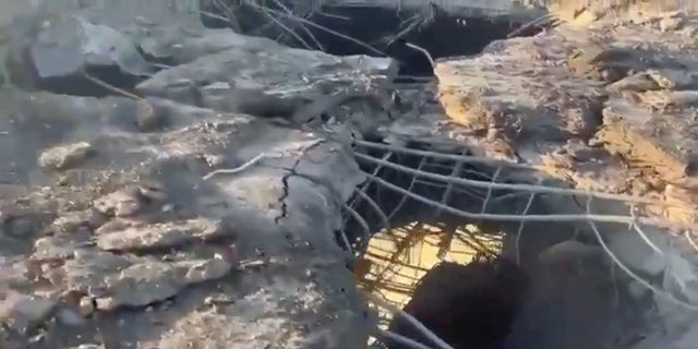 A view shows the damaged Antonivskyi bridge in the aftermath of shelling, in Kherson, Ukraine, in this screen grab obtained from a social media video released July 27, 2022.