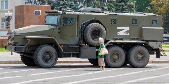 An armoured truck of pro-Russian troops is parked near Ukraine's former regional council's building during Ukraine-Russia conflict in the Russia-controlled city of Kherson, Ukraine July 25, 2022.