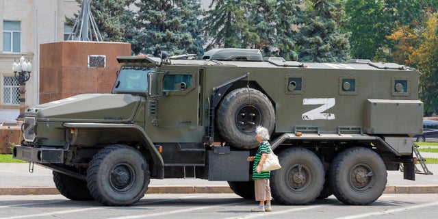 An armoured truck of pro-Russian troops is parked near Ukraine's former regional council's building during Ukraine-Russia conflict in the Russia-controlled city of Kherson, Ukraine July 25, 2022.