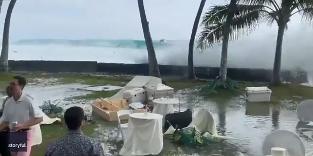 The weekend Hawaii beachside wedding was interrupted by a tropical storm on July 16, 2022.