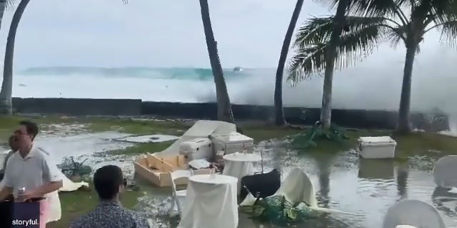 The weekend Hawaii beachside wedding was interrupted by a tropical storm on July 16, 2022.