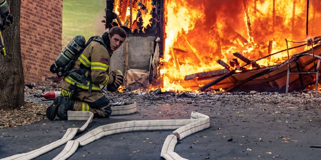 Janesville Fire Department Firefighters respond to a house fire on July 17, 2022