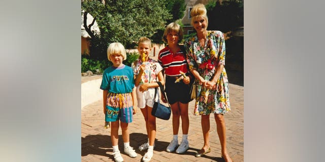 Ivana Trump posing with kids Ivanka, Donald Jr. and Eric.