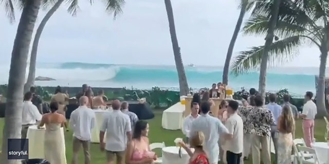 A Hawaii beachside wedding ceremony over the weekend was interrupted by a tropical storm on July 16, 2022.