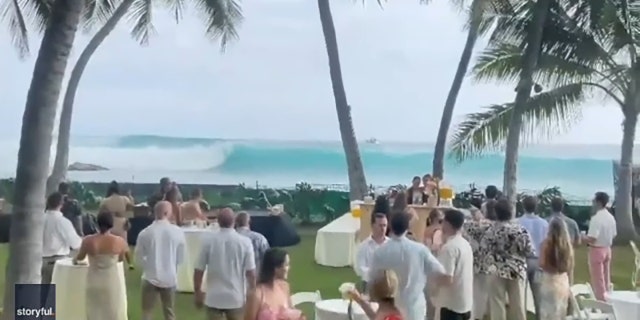 A Hawaii beachside wedding ceremony over the weekend was interrupted by a tropical storm on July 16, 2022.