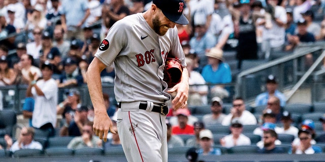 Boston Red Sox starting pitcher Chris Sale comes off the hill after injuring his hand during the first half against the New York Yankees on Sunday, July 17, 2022, in New York City. 