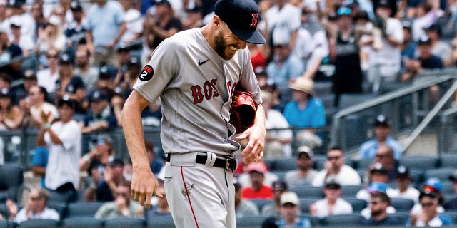 Boston Red Sox starting pitcher Chris Sale comes off the hill after injuring his hand during the first half against the New York Yankees on Sunday, July 17, 2022, in New York City.