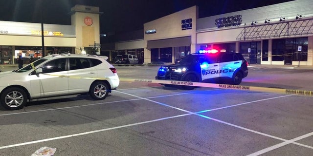 Houston police at the scene where a robbery suspect was shot and killed by his alleged victim near an ATM.