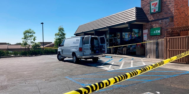 Police investigate a shooting at a 7-Eleven store in Brea, California, on Monday, July 11, 2022.