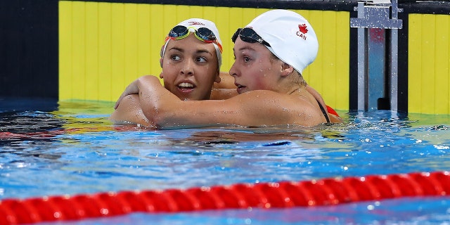 Tessa Camile Cieplucha of Canada and Mary-Sophie Harvey of Canada greet after competing in Women's 400m Individual Medley Final A on Day 14 of Lima 2019 Pan American Games at Aquatics Center of Villa Deportiva Nacional on August 09, 2019 in Lima, Peru.