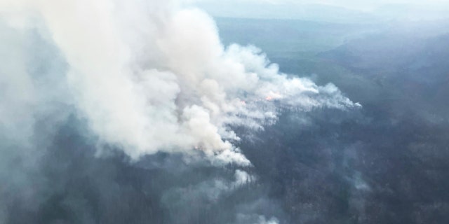 Smoke billows from Alaska's Troublesome Fire. The Troublesome Fire has burned more than 12,000 acres.