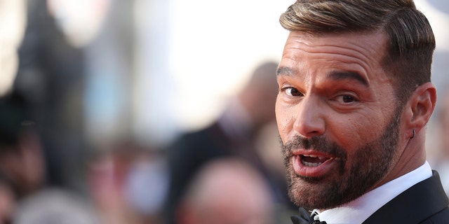 FILE - Ricky Martin poses for photographers upon arrival at the premiere of the film 'Elvis' at the 75th international film festival, Cannes, southern France, May 25, 2022.  (Photo by Vianney Le Caer/Invision/AP File)