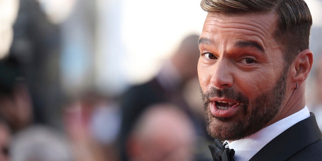 FILE - Ricky Martin poses for photographers upon arrival at the premiere of the film 'Elvis' at the 75th international film festival, Cannes, southern France, May 25, 2022.  (Photo by Vianney Le Caer/Invision/AP File)