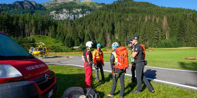 Rescuers prepare to conduct searches for the victims of the Punta Rocca glacier avalanche in Canazei, in the Italian Alps in northern Italy, on Tuesday, July 5.