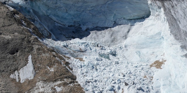 A view taken from a rescue helicopter of the Punta Rocca glacier near Canazei, in the Italian Alps in northern Italy, on Tuesday, July 5, two days after a huge chunk of the glacier broke loose, sending an avalanche of ice, snow, and rocks onto hikers. 