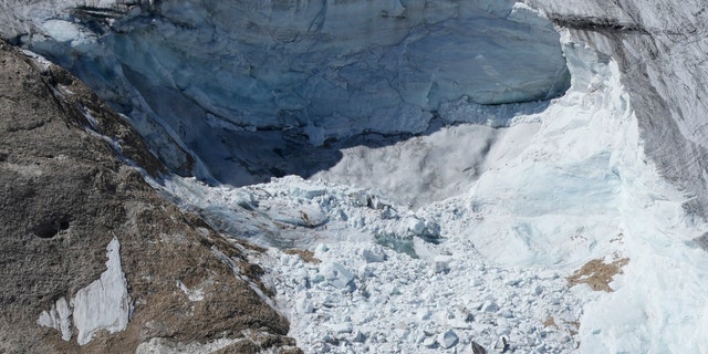 A view taken from a rescue helicopter of the Punta Rocca glacier near Canazei, in the Italian Alps in northern Italy, on Tuesday, July 5, two days after a huge chunk of the glacier broke loose, sending an avalanche of ice, snow, and rocks onto hikers.