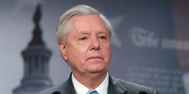 Sen. Lindsey Graham speaks with reporters about aid to Ukraine, on Capitol Hill, March 10, 2022. 
