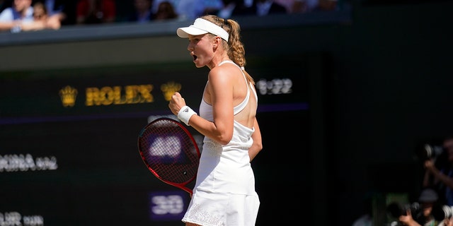 Kazakhstan's Elena Rybakina celebrates a point against Tunisia's Ons Jabeur in the women's singles final at Wimbledon in London Saturday, July 9, 2022.