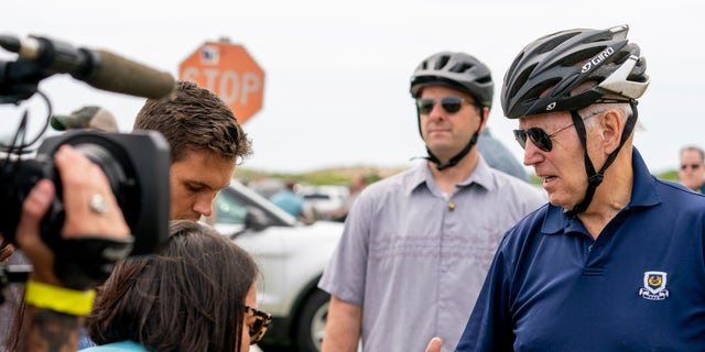 President Joe Biden speaks to members of the media as he goes on a bike ride in Gordons Pond State Park in Rehoboth Beach, Del., Sunday, July 10, 2022. 