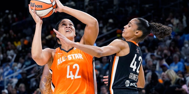 Team Wilson's Brionna Jones, left, shoots against Team Stewart's Skylar Diggins-Smith during the second half of a WNBA All-Star basketball game.