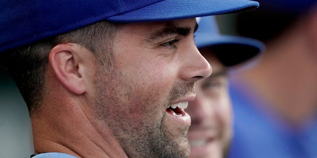 The Kansas City Royals' Whit Merrifield watches from the dugout during the second inning of the second game of a doubleheader against the Detroit Tigers July 11, 2022, in Kansas City, Mo.