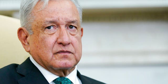 Mexican President Andrés Manuel López Obrador listens to his meeting with President Joe Biden in the Oval Office of the White House on Tuesday, July 12, 2022. 