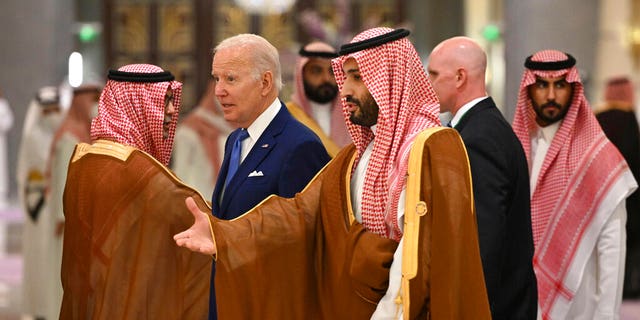 U.S. President Joe Biden, center left, and Saudi Crown Prince Mohammed bin Salman, center, arrive for the family photo during the "GCC+3" 