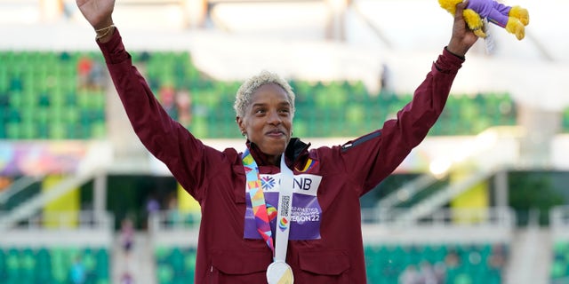 Gold medalist Yulimar Rojas, of Venezuela, celebrates during a medal ceremony for triple jump women at the World Athletics Championships.