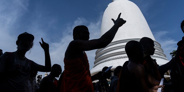 Protesters shout slogans demanding acting president and prime minister Ranil Wickremesinghe resign in Colombo, Sri Lanka, in Colombo, Sri Lanka, Tuesday, July 19, 2022.