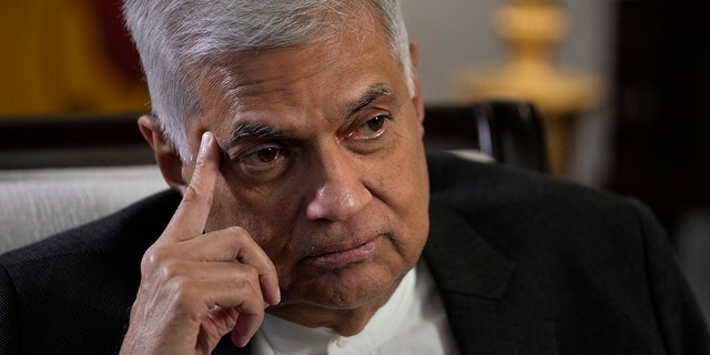 FILE - Sri Lanka's Ranil Wickremesinghe gestures during an interview with The Associated Press in Colombo, Sri Lanka, Saturday, June 11, 2022. 