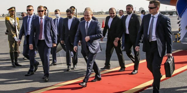 Russian President Vladimir Putin, center, upon his arrival at an International Airport outside Tehran, Iran, Tuesday, July 19, 2022. Putin is in Iran to deepen ties with regional heavyweights as part of Moscow's challenge to the United States and Europe during its campaign in Ukraine. 