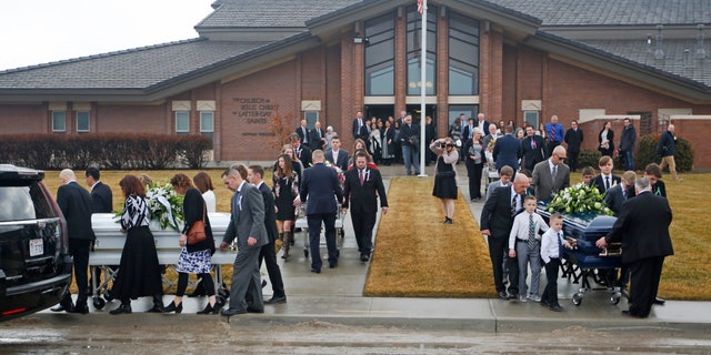 Colin "CJ" Haynie pleaded guilty Tuesday, July 19, 2022, to killing his mother and three siblings when he was a teenager in 2020. Pictured: The caskets of the victims are carried following funeral services on Jan. 24, 2020, in Grantsville, Utah.