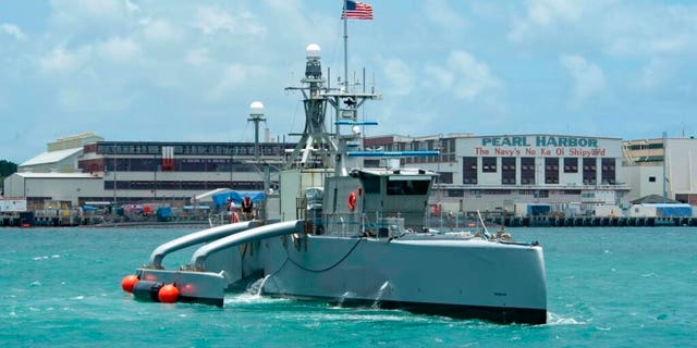 In this image provided by the U.S. Navy, a Sea Hunter crewless vessel arrives at Pearl Harbor, Hawaii, to participate in the Rim of the Pacific exercise, June 29, 2022.